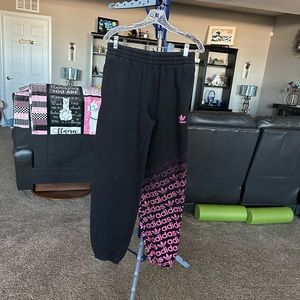 Adidas’s black with pink adidas on one leg sweatpants. Size XL